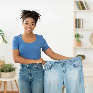 Weight Loss Middle GA Lady Holding Her Old Pants