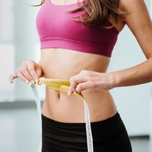 Weight Loss Middle GA Woman Measuring Waistline